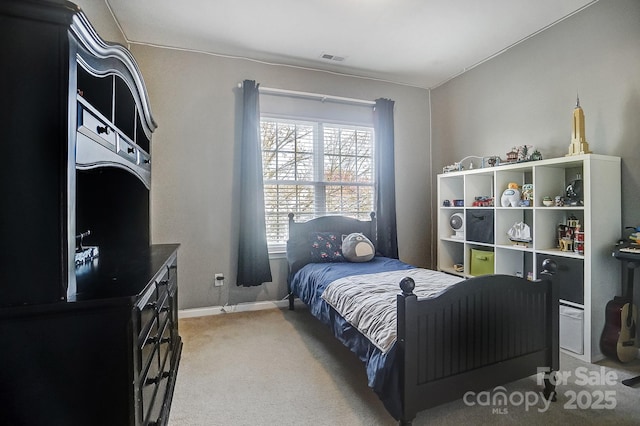 bedroom with light colored carpet