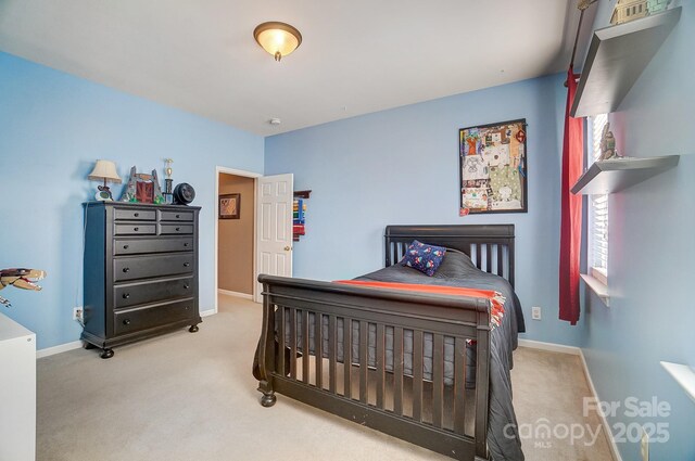 bedroom featuring carpet flooring and multiple windows