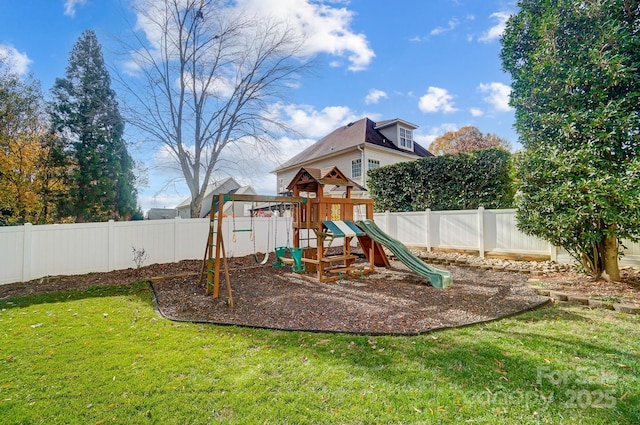 view of playground with a lawn