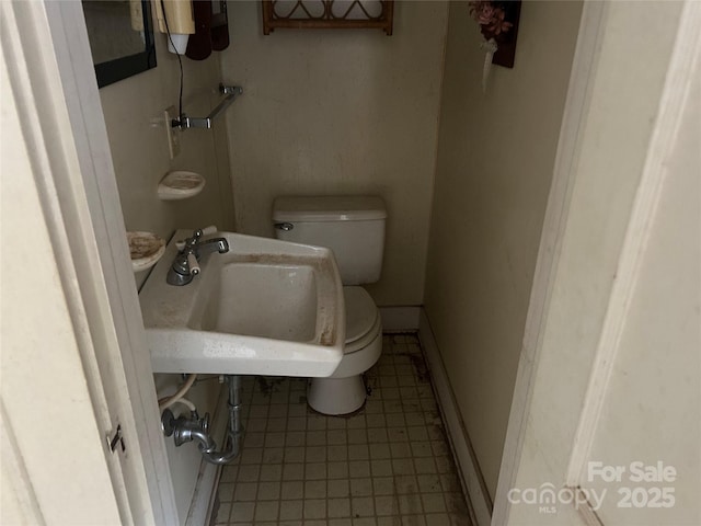 bathroom with sink and toilet