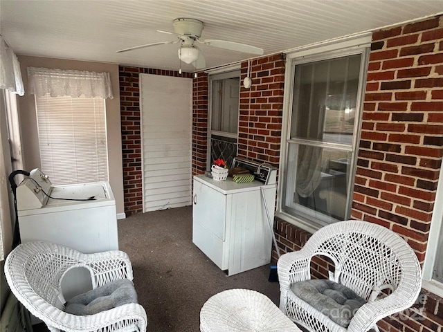 interior space with ceiling fan and washer and dryer