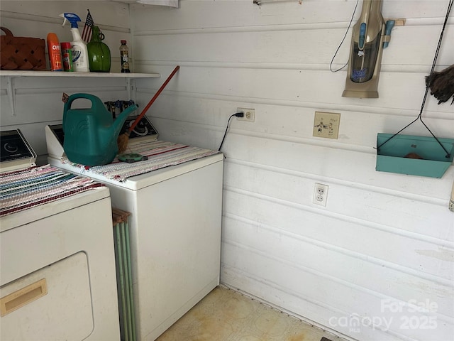 laundry area with washing machine and clothes dryer