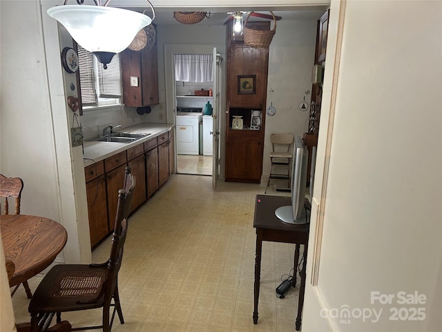 kitchen with sink and separate washer and dryer