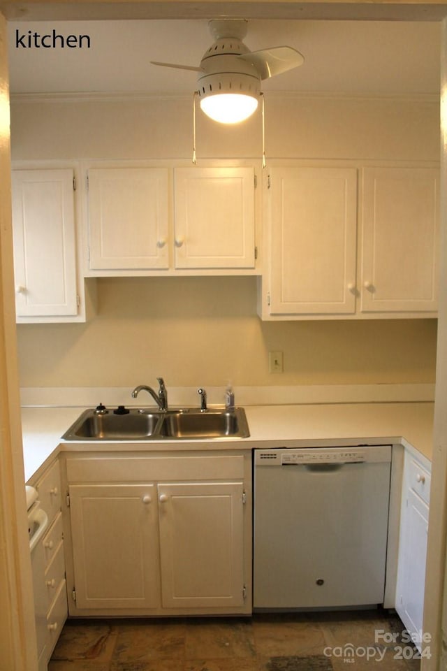 kitchen with dishwasher, white cabinetry, and sink