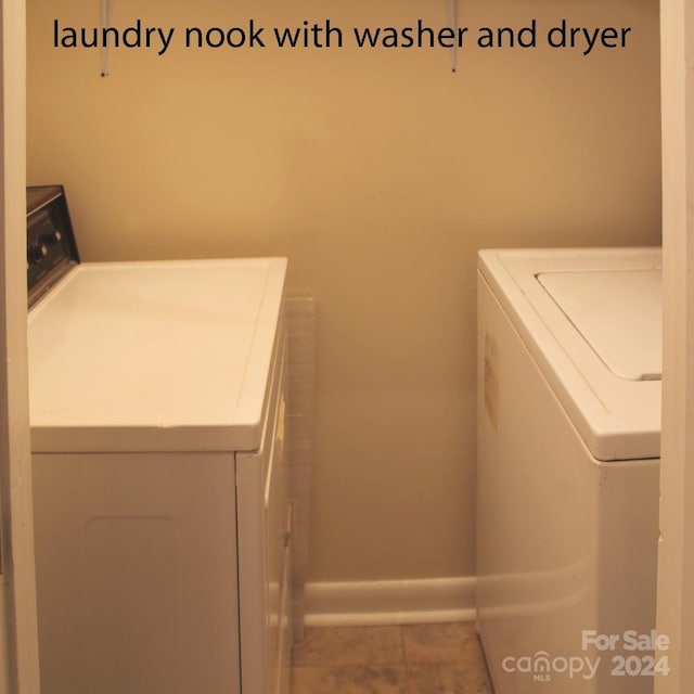 laundry area with washing machine and clothes dryer