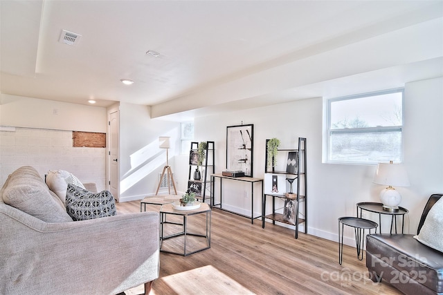 living room with light hardwood / wood-style flooring