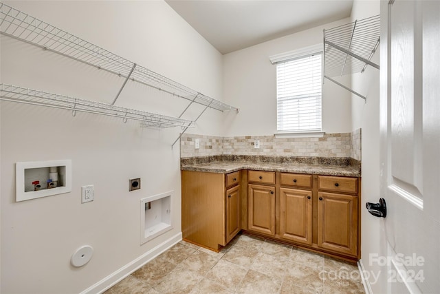 clothes washing area featuring washer hookup, electric dryer hookup, and hookup for a gas dryer