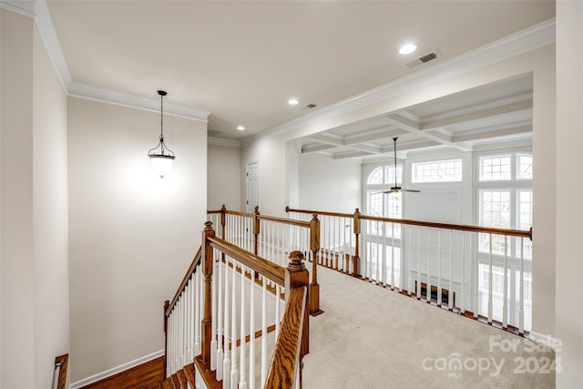 hallway with beamed ceiling, wood-type flooring, coffered ceiling, and ornamental molding