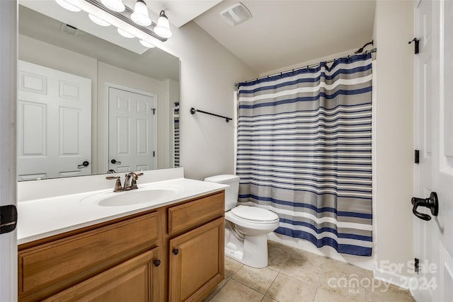 bathroom featuring tile patterned floors, vanity, toilet, and a shower with curtain