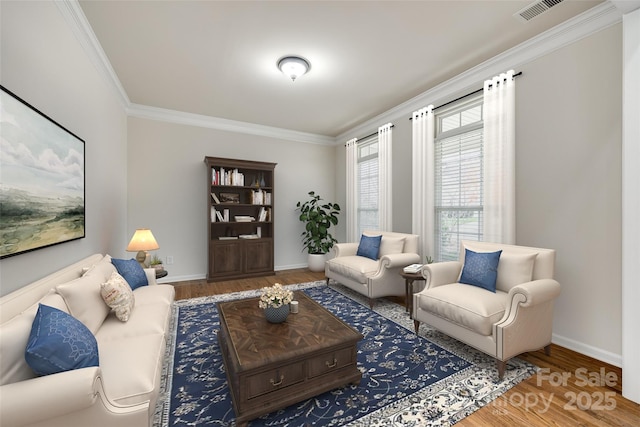 living room with ornamental molding and hardwood / wood-style floors