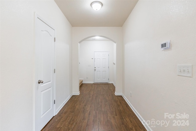 hallway featuring dark wood-type flooring