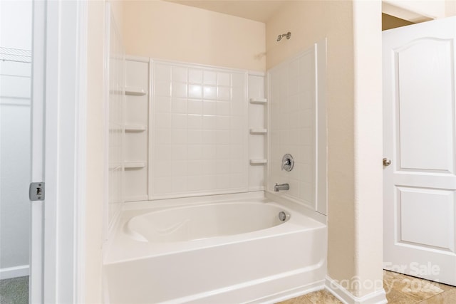 bathroom with tile patterned flooring and shower / washtub combination