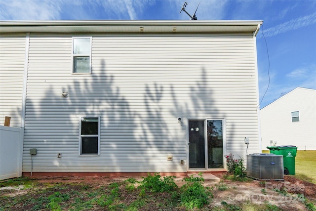 back of house featuring central air condition unit