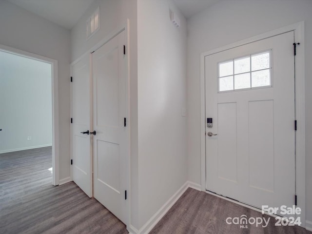 entryway with hardwood / wood-style floors