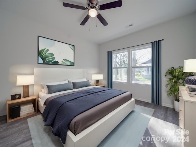 bedroom with ceiling fan and hardwood / wood-style floors