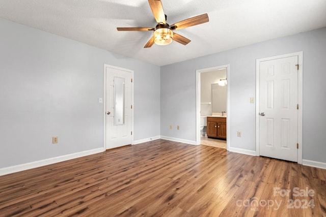 interior space with hardwood / wood-style floors and ceiling fan