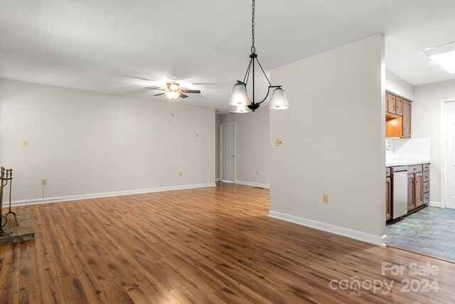 924 Cranberry Cir Unit 50-C, Fort Mill, SC 29715 - unfurnished living room featuring wood finished floors, ceiling fan, baseboards, and a chandelier