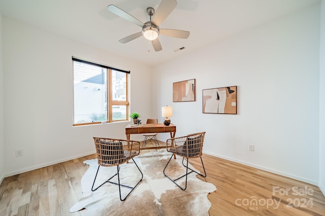 office area with ceiling fan and light wood-type flooring