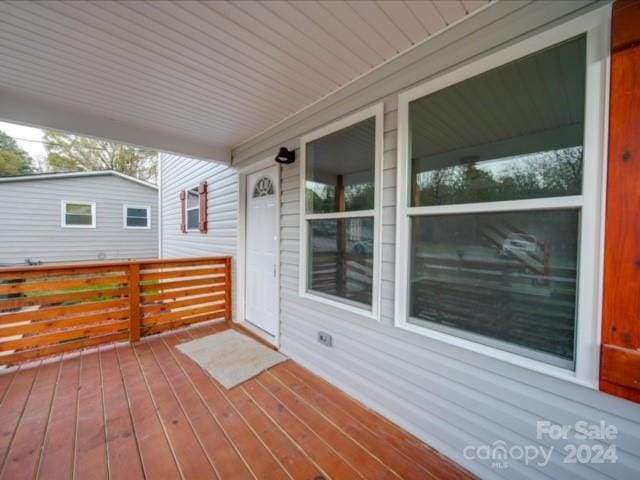 wooden deck featuring covered porch