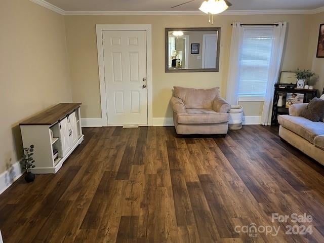 living room featuring ceiling fan, crown molding, and dark wood-type flooring