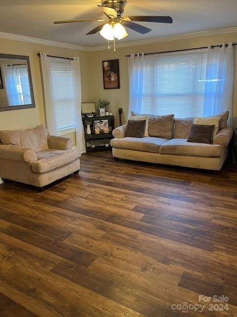 living room with ceiling fan, crown molding, dark wood-type flooring, and plenty of natural light