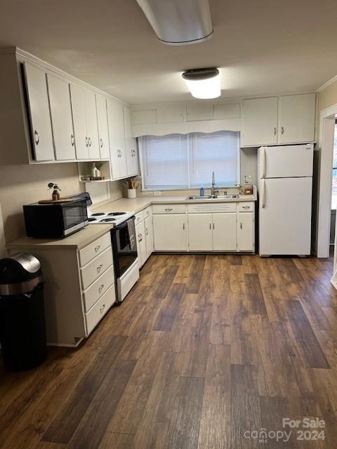 kitchen featuring white cabinets, dark hardwood / wood-style floors, and white appliances