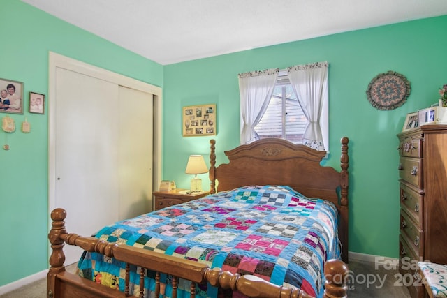 bedroom with carpet flooring and a closet