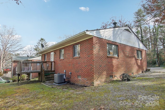 view of property exterior featuring cooling unit and a deck