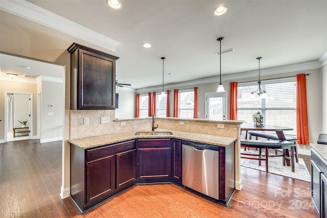 kitchen with dishwasher, light wood-type flooring, plenty of natural light, and sink