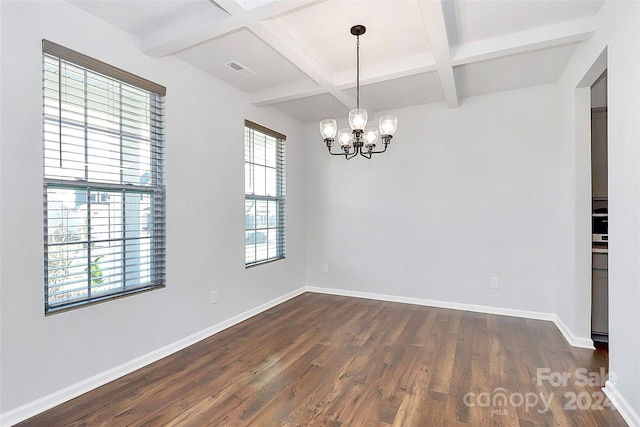 spare room featuring coffered ceiling, beam ceiling, dark wood-type flooring, and a chandelier