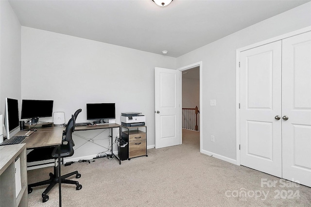 office area featuring light colored carpet