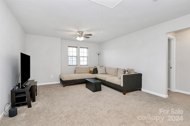 carpeted living room featuring ceiling fan