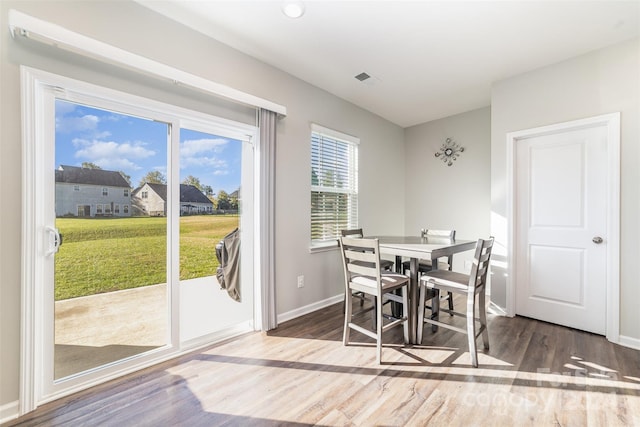 dining space featuring hardwood / wood-style floors