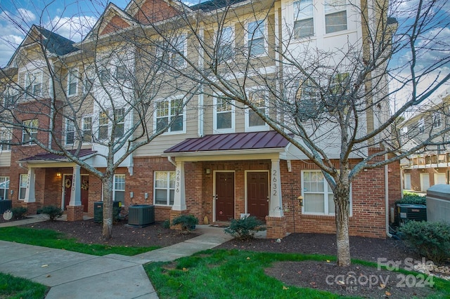 townhome / multi-family property featuring central air condition unit