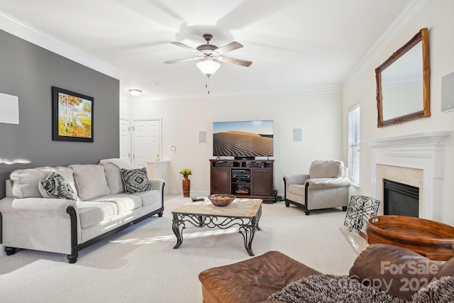 living room featuring carpet flooring, ceiling fan, and ornamental molding