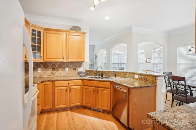 kitchen featuring white appliances, crown molding, sink, light stone countertops, and light hardwood / wood-style floors