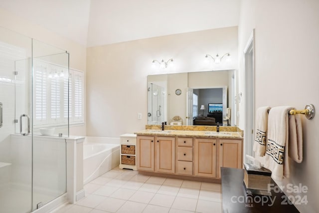 bathroom featuring vanity, separate shower and tub, and tile patterned floors