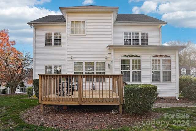 back of property featuring a deck