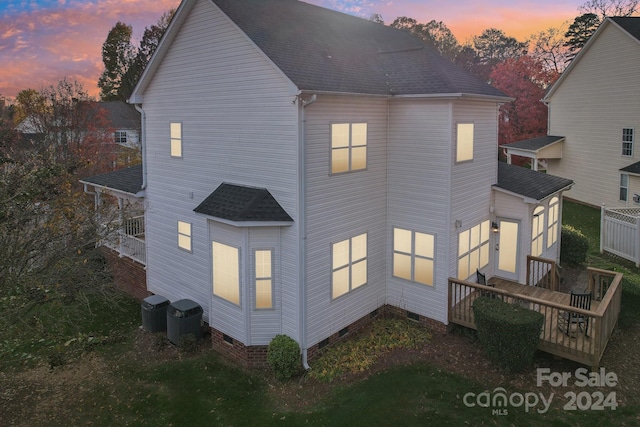 back house at dusk with cooling unit