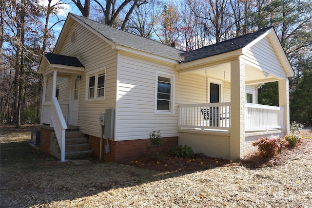 view of property exterior featuring covered porch