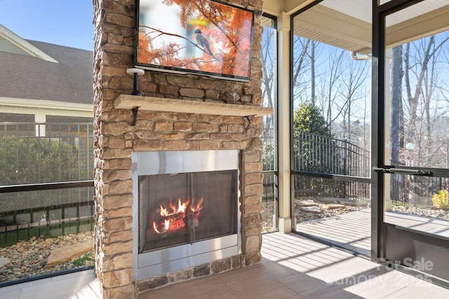 details featuring an outdoor stone fireplace