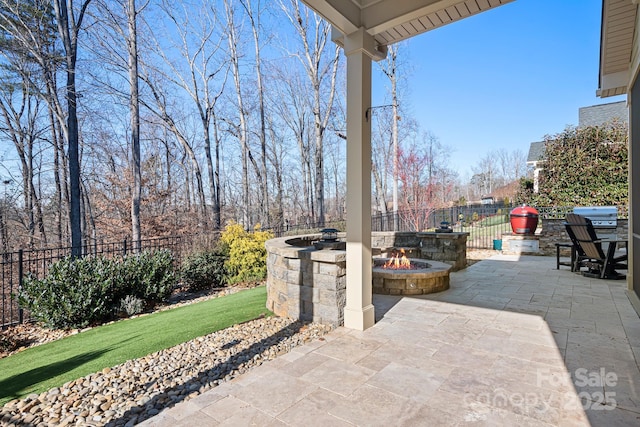 view of patio with a fire pit