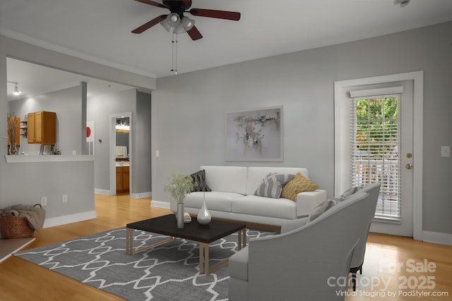 living room featuring ceiling fan and light wood-type flooring