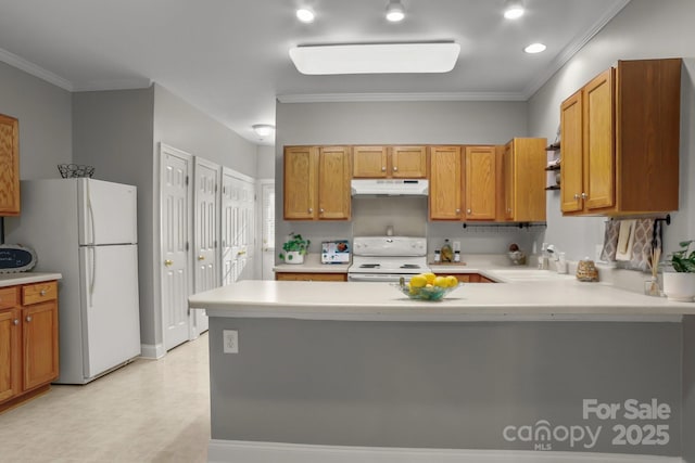 kitchen with kitchen peninsula, white appliances, crown molding, and sink