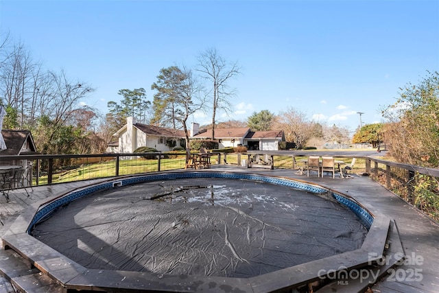 view of swimming pool featuring a fenced in pool and a residential view