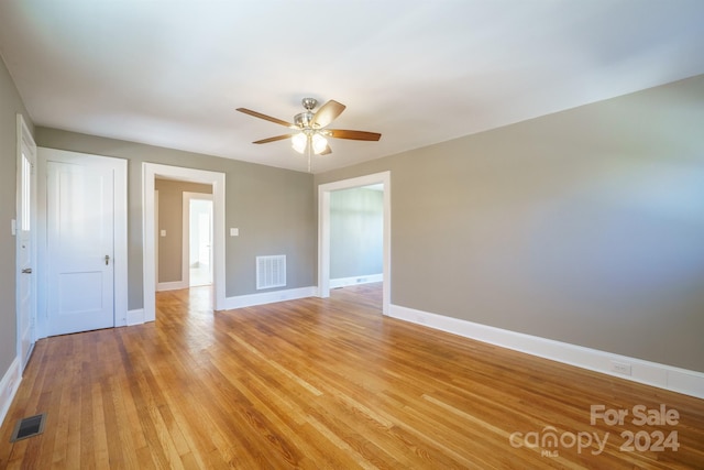 unfurnished room featuring ceiling fan and light hardwood / wood-style floors