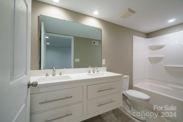 full bathroom with vanity,  shower combination, and toilet