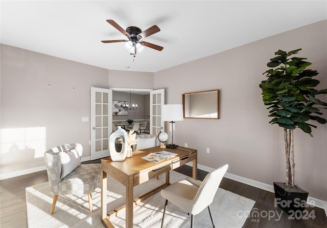 home office featuring ceiling fan, french doors, and dark hardwood / wood-style floors