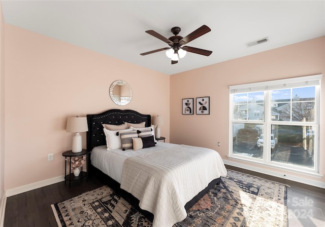 bedroom featuring ceiling fan and dark hardwood / wood-style flooring