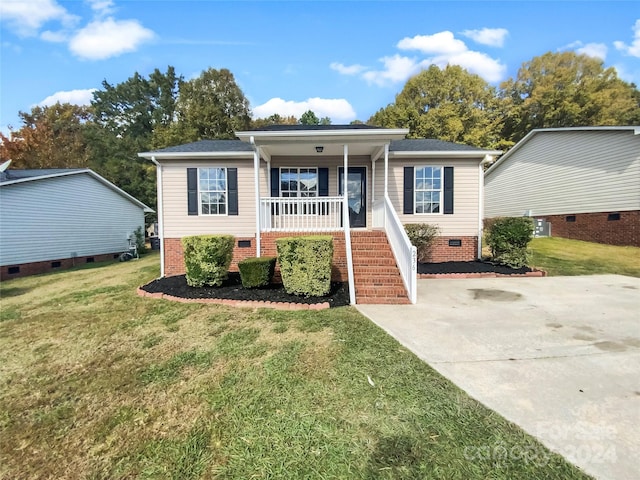 view of front of property with a porch and a front lawn